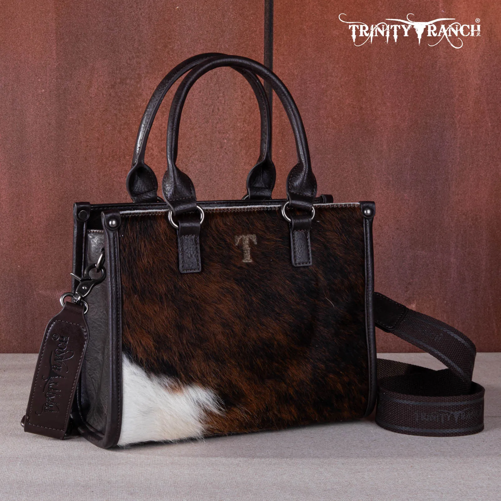 TR164-8250A  Trinity Ranch Hair On Cowhide Tooling Concealed Carry Tote/Crossbody