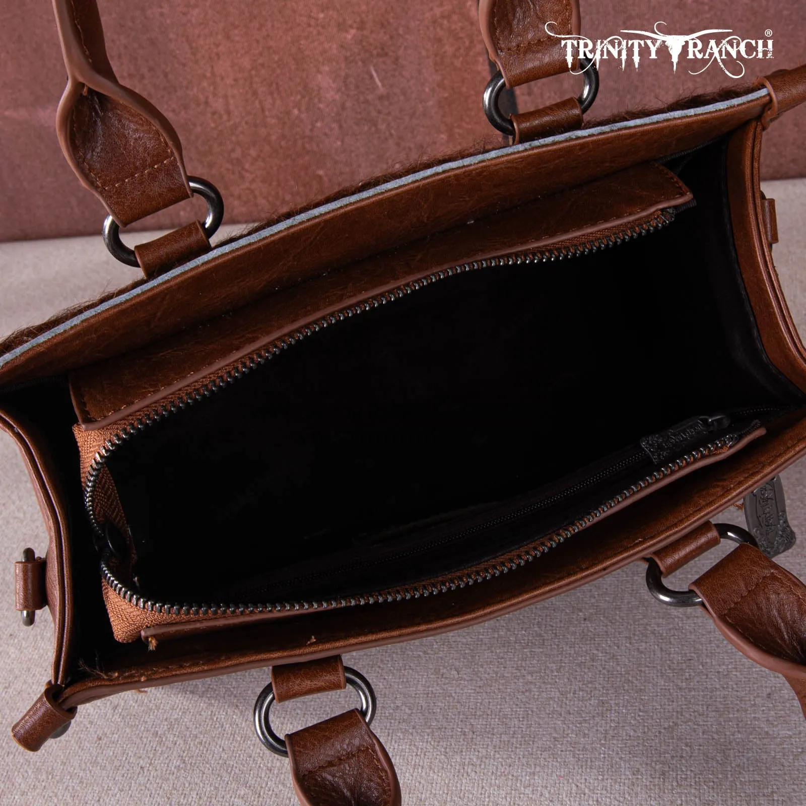 TR164-8250A  Trinity Ranch Hair On Cowhide Tooling Concealed Carry Tote/Crossbody