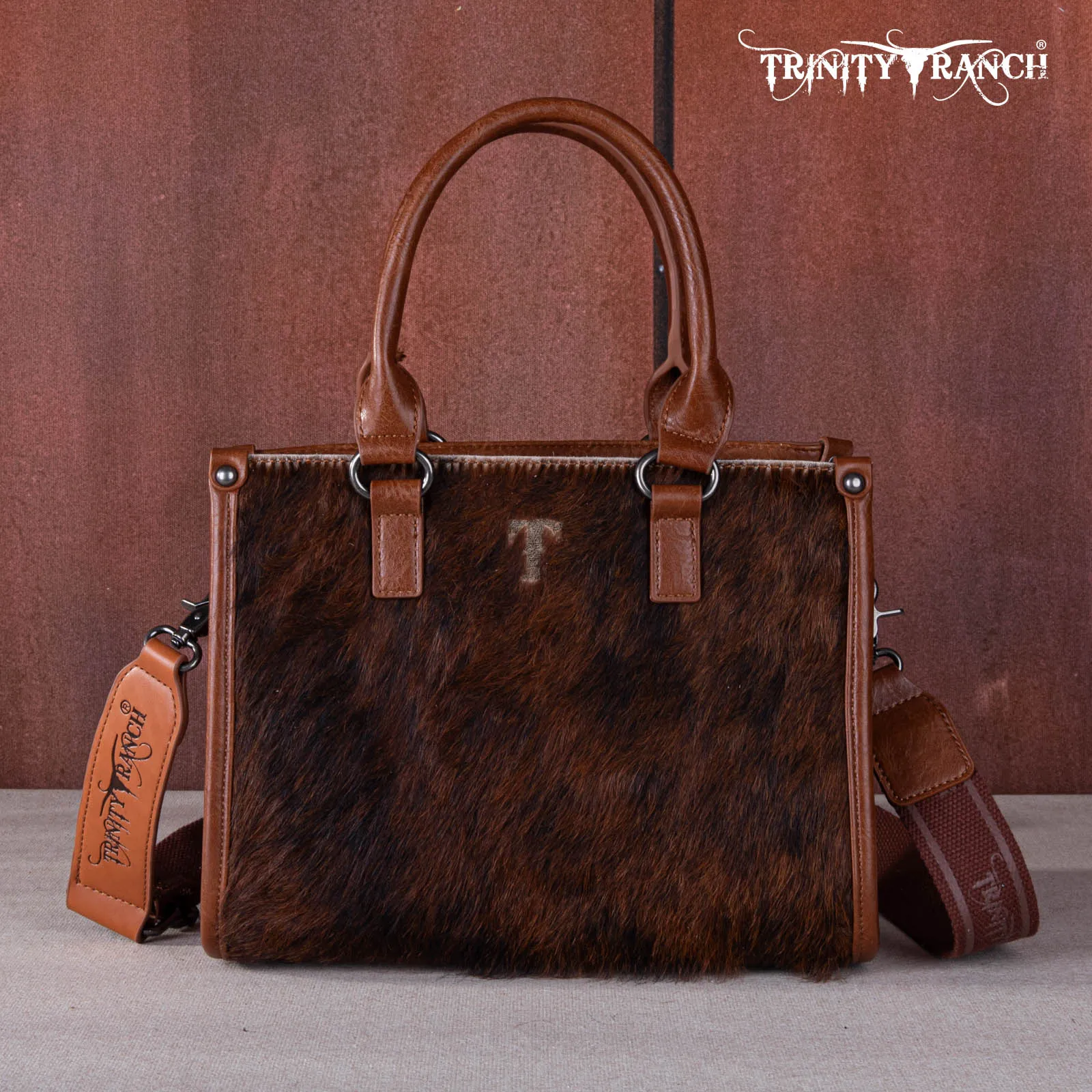 TR164-8250A  Trinity Ranch Hair On Cowhide Tooling Concealed Carry Tote/Crossbody