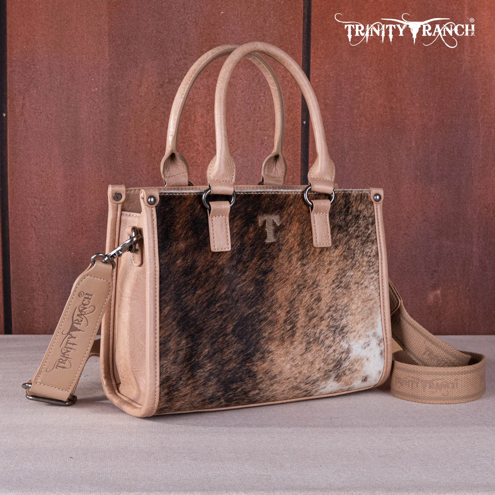 TR164-8250A  Trinity Ranch Hair On Cowhide Tooling Concealed Carry Tote/Crossbody