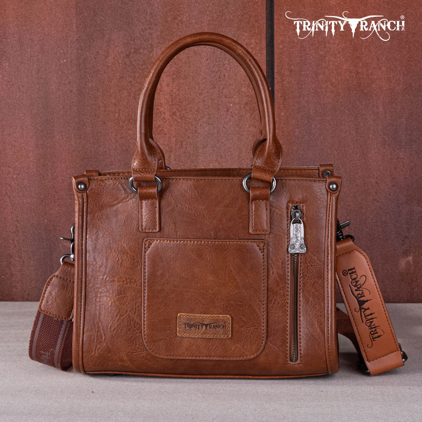 TR164-8250A  Trinity Ranch Hair On Cowhide Tooling Concealed Carry Tote/Crossbody