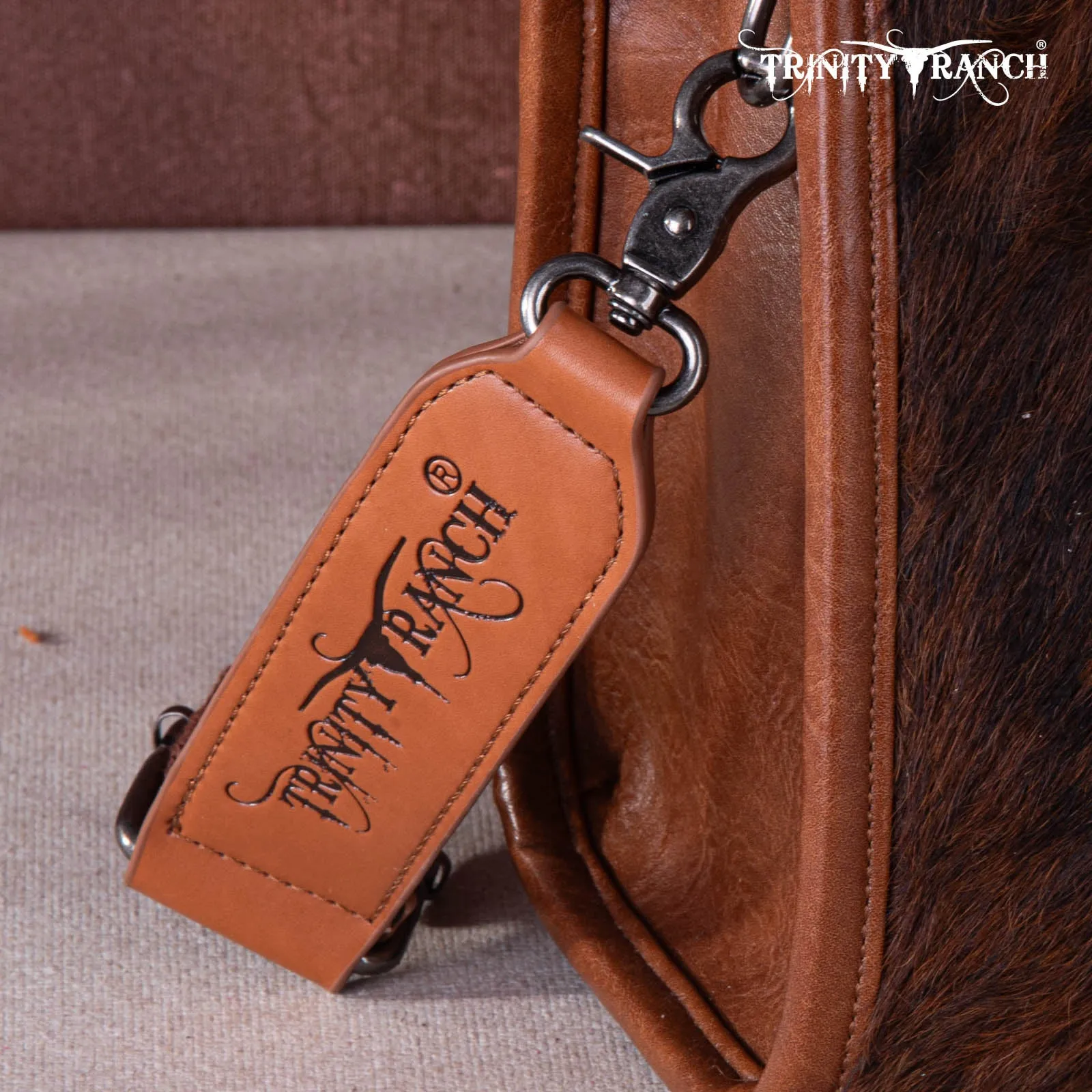 TR164-8250A  Trinity Ranch Hair On Cowhide Tooling Concealed Carry Tote/Crossbody