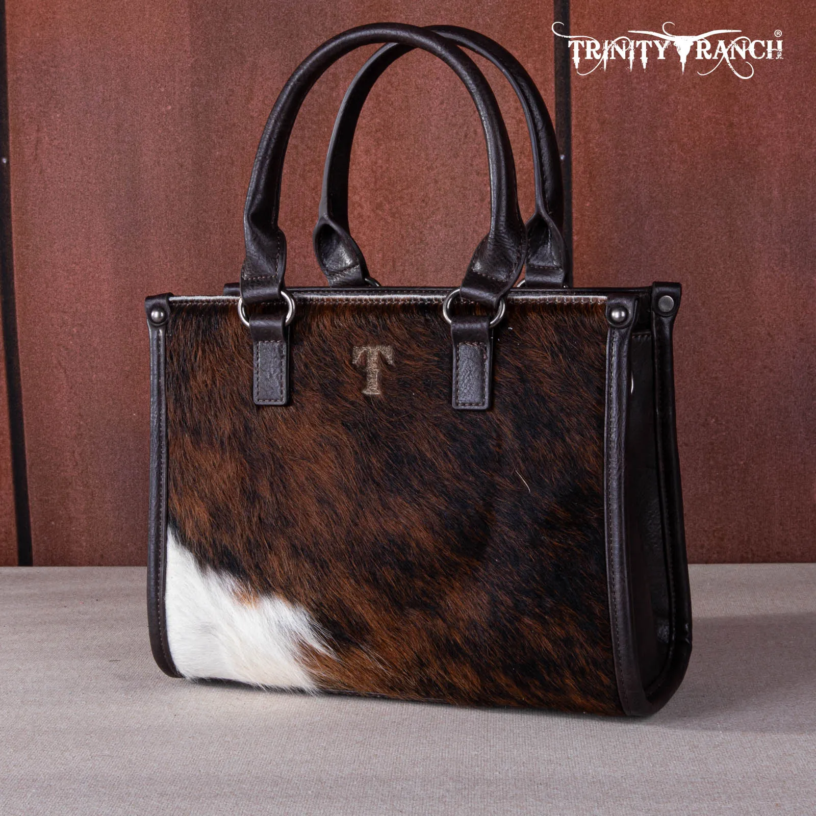 TR164-8250A  Trinity Ranch Hair On Cowhide Tooling Concealed Carry Tote/Crossbody