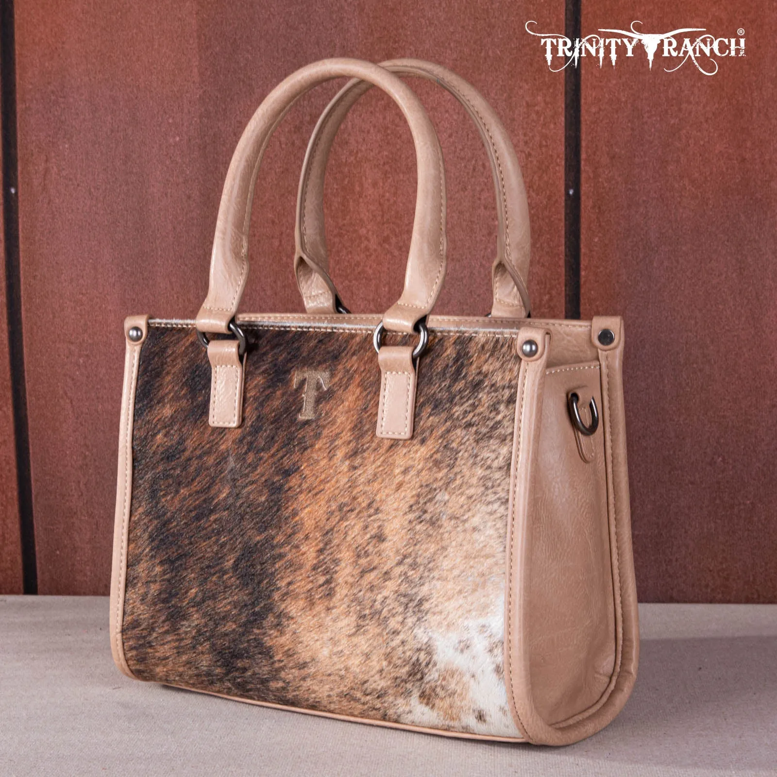 TR164-8250A  Trinity Ranch Hair On Cowhide Tooling Concealed Carry Tote/Crossbody