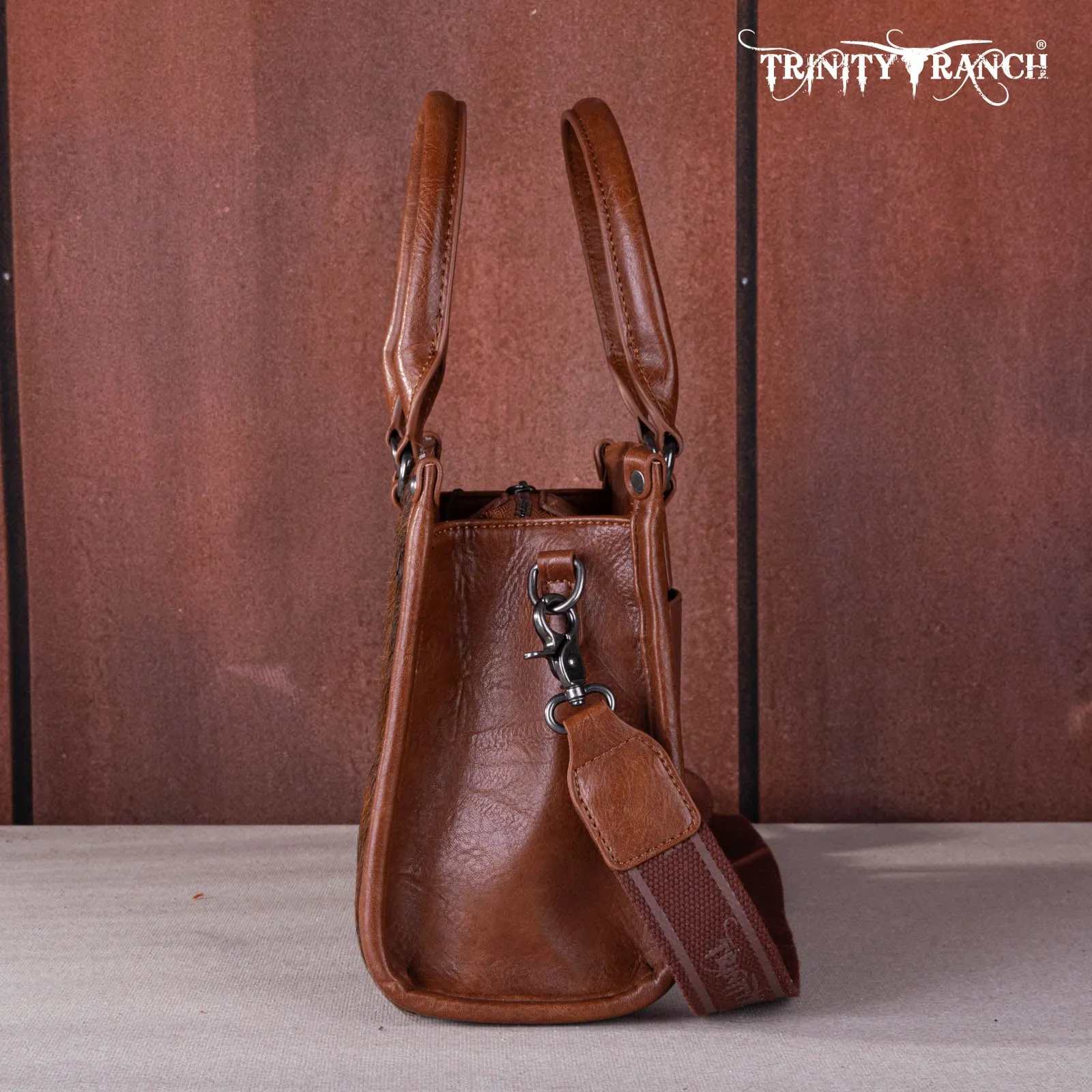 TR164-8250A  Trinity Ranch Hair On Cowhide Tooling Concealed Carry Tote/Crossbody