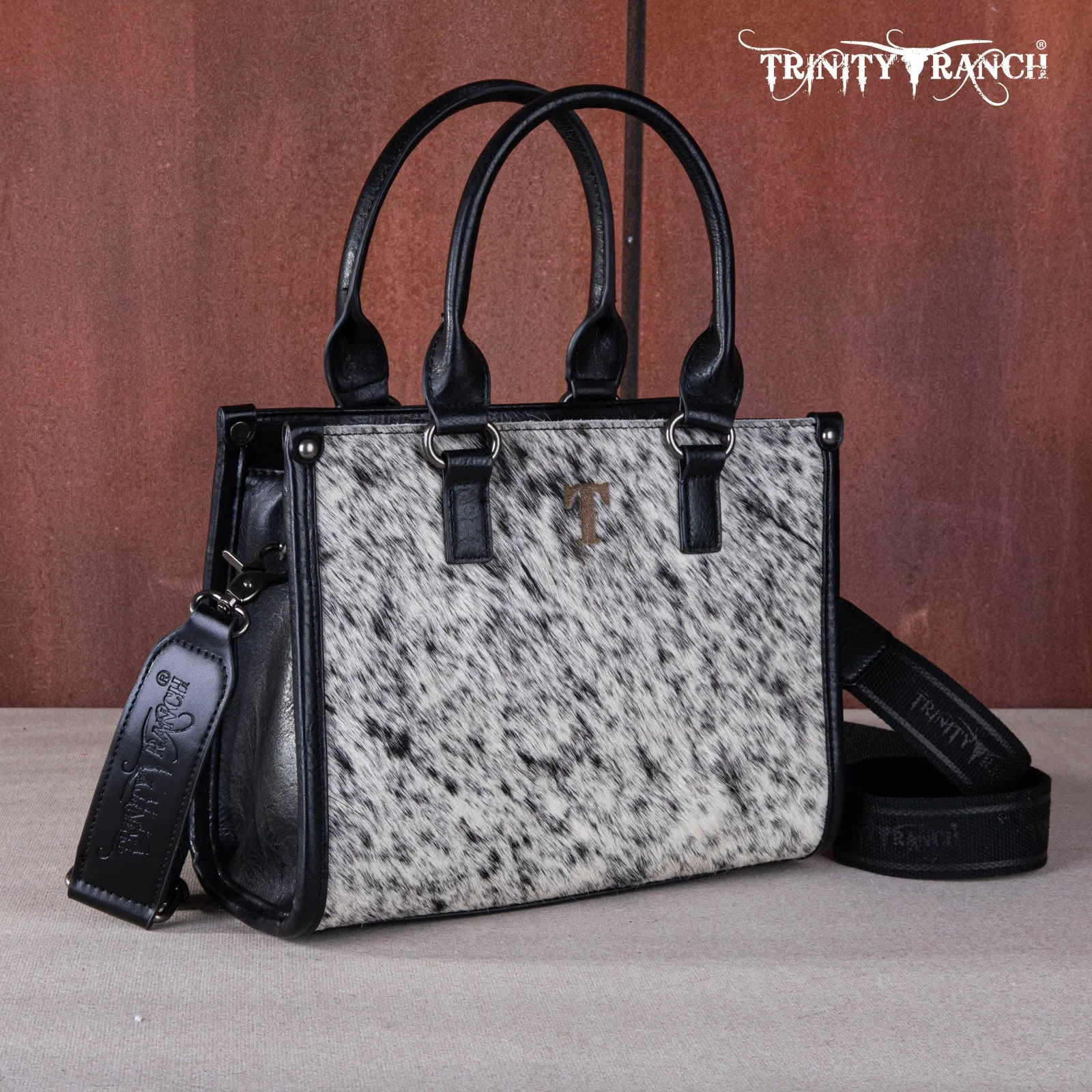 TR164-8250A  Trinity Ranch Hair On Cowhide Tooling Concealed Carry Tote/Crossbody